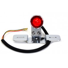 Tail lamp is LED type with bracket, red plastic lens, and chrome housing.